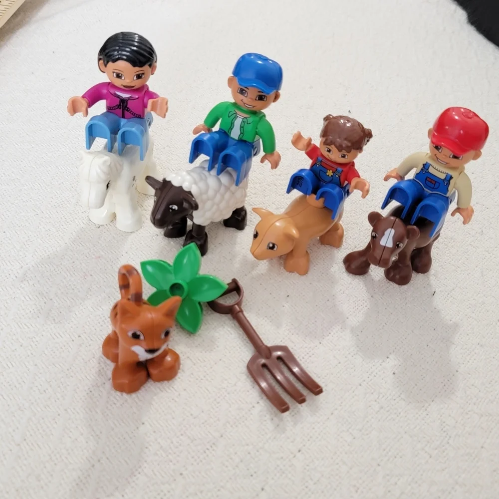 Lego Farmers set with 10 figures, including a farmer, farmer's wife, and 2 kids,